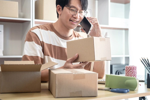 A man calling for parcel delivery services